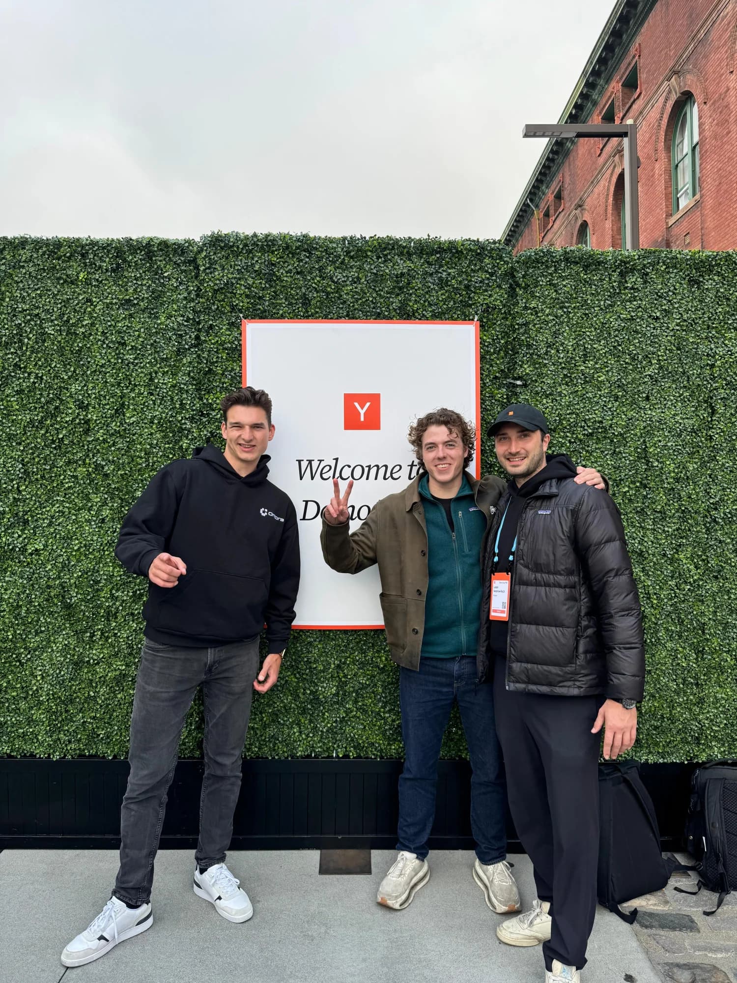 Max, David and Leon in front of the Y Combinator Demo Day sign